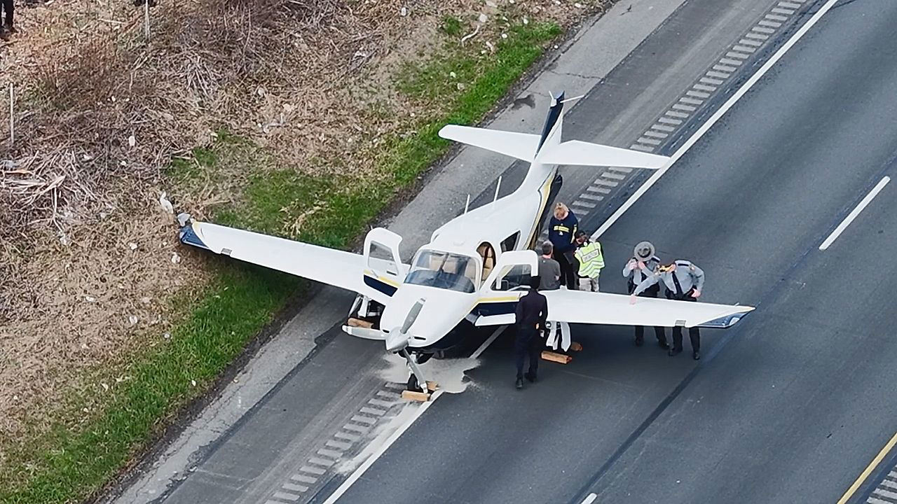 Small Plane Lands on I-10 with Less Than Two Feet Clearance Under Bridge, No Injuries Reported